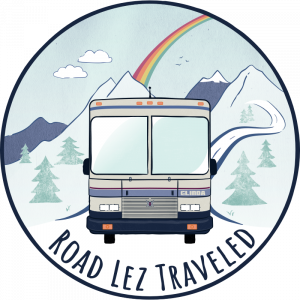 logo with RV and road